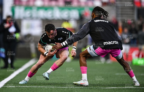 040426 - Ulster v Ospreys - EPCR Challenge Cup Round of 16 - Luke Morgan, left, is tackled by Ospreys teammate Daniel Kasende in the warm-up before the match