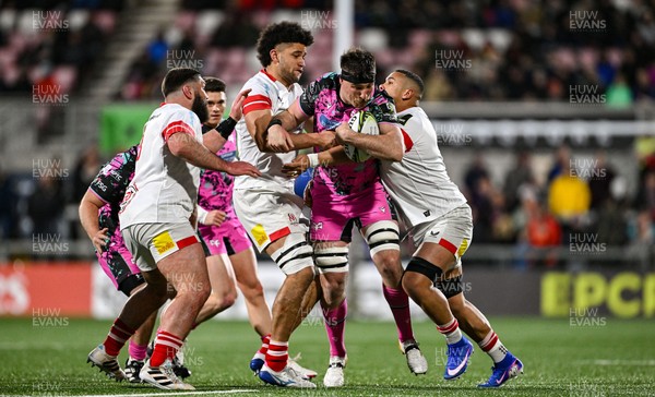 040426 - Ulster v Ospreys - EPCR Challenge Cup Round of 16 - Ryan Smith of Ospreys is tackled by Cormac Izuchukwu, left, and Juarno Augustus of Ulster