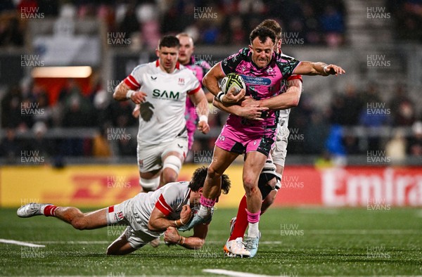 040426 - Ulster v Ospreys - EPCR Challenge Cup Round of 16 - Luke Morgan of Ospreys is tackled by Ethan McIlroy, left, and Iain Henderson of Ulster