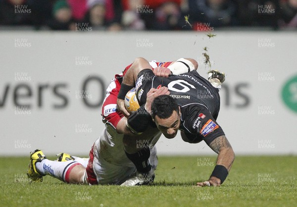 080213 Ulster v Ospreys - RaboDirect Pro12 - Kahn Fotuali'i of Ospreys is tackled by Johann Muller of Ulster 