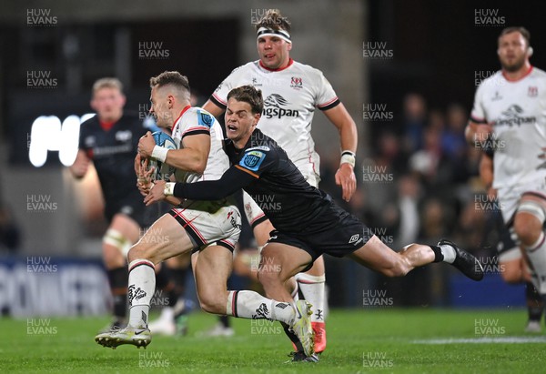 081022 - Ulster v Ospreys - BKT United Rugby Championship - Michael Lowry of Ulster is tackled by Jack Walsh of Ospreys