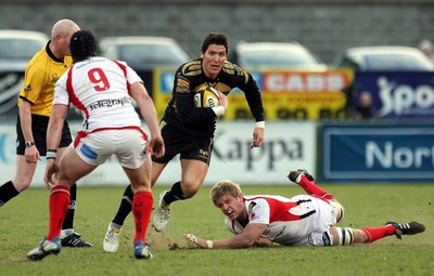 13.04.10 - Ulster v Ospreys - Magners League -  Ospreys' James Hook slips a tackle from Ulster's Chris Henry 