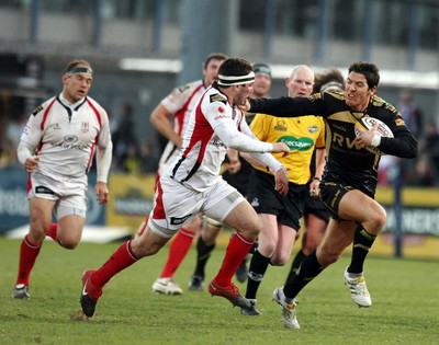 13.04.10 - Ulster v Ospreys - Magners League -  Ospreys' James Hook hands off Ulster's Paddy Wallace 