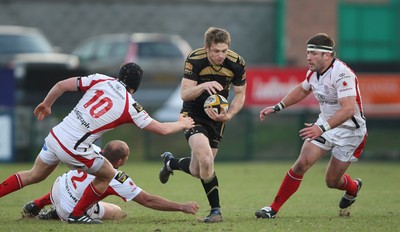 13.04.10 - Ulster v Ospreys - Magners League -  Dan Biggar of Ospreys beats the tackle of Niall O'Connor, Rory Best and Bryan Young of Ulster 