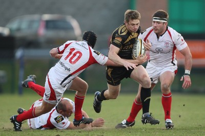 13.04.10 - Ulster v Ospreys - Magners League -  Dan Biggar of Ospreys beats the tackle of Niall O'Connor, Rory Best and Bryan Young of Ulster 