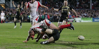 13.04.10 Ulster v Ospreys... Tommy Bowe scores for Ospreys despite the tackle of Rory Best of Ulster. 