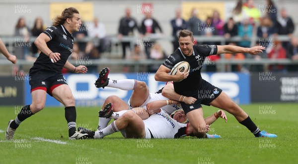 200518 - Ulster v Ospreys - PRO14 Champion's Cup Play-off - Ashley Beck of Ospreys is tackled by Jacob Stockdale and Luke Marshall of Ulster