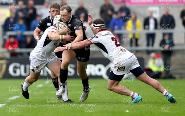 200518 - Ulster v Ospreys - PRO14 Champion's Cup Play-off - Cory Allen of Ospreys is tackled by Luke Marshall and Rob Herring of Ulster