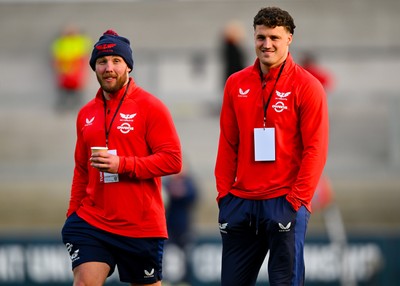 010325 - Ulster v Scarlets - United Rugby Championship - Tomi Lewis of Scarlets, right, walks the pitch before the match