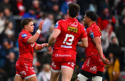 010325 - Ulster v Scarlets - United Rugby Championship - Macs Page of Scarlets, left, celebrates with team mates after scoring his side's first try