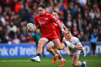 010325 - Ulster v Scarlets - United Rugby Championship - Macs Page of Scarlets on his way to scoring his side's first try despite the efforts of Conor McKee of Ulster