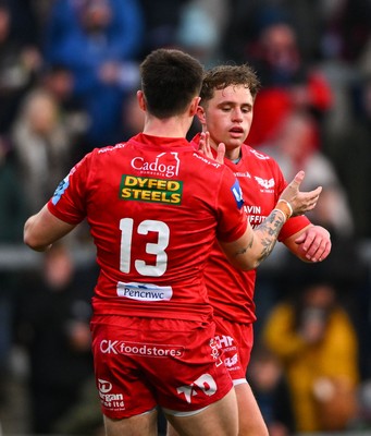 010325 - Ulster v Scarlets - United Rugby Championship - Macs Page of Scarlets, right, celebrates with team mate Joe Roberts after scoring his side's first try