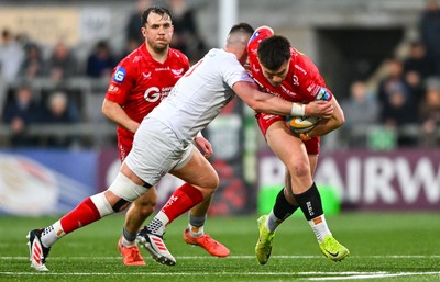 010325 - Ulster v Scarlets - United Rugby Championship - Joe Roberts of Scarlets is tackled by James Hume of Ulster