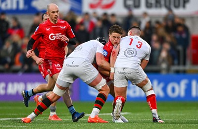 010325 - Ulster v Scarlets - United Rugby Championship - Macs Page of Scarlets is tackled by Ulster players  James McNabney, left, and James Hume