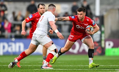 010325 - Ulster v Scarlets - United Rugby Championship - Joe Roberts of Scarlets is tackled by James Hume of Ulster