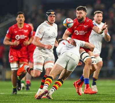 010325 - Ulster v Scarlets - United Rugby Championship - Max Douglas of Scarlets offloads the ball despite the tackle of Jacob Stockdale of Ulster