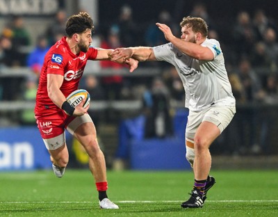 010325 - Ulster v Scarlets - United Rugby Championship - Johnny Williams of Scarlets is tackled by Scott Wilson of Ulster