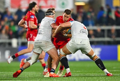 010325 - Ulster v Scarlets - United Rugby Championship - Jarrod Taylor of Scarlets is tackled by Ulster players Rob Herring, left, and Matty Rea