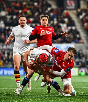 010325 - Ulster v Scarlets - United Rugby Championship - Michael Lowry of Ulster is tackled by Macs Page of Scarlets