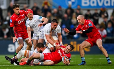 010325 - Ulster v Scarlets - United Rugby Championship - Ioan Llyod of Scarlets in action against Ulster players, from left, Michael Lowry, Callum Reid and James Hume