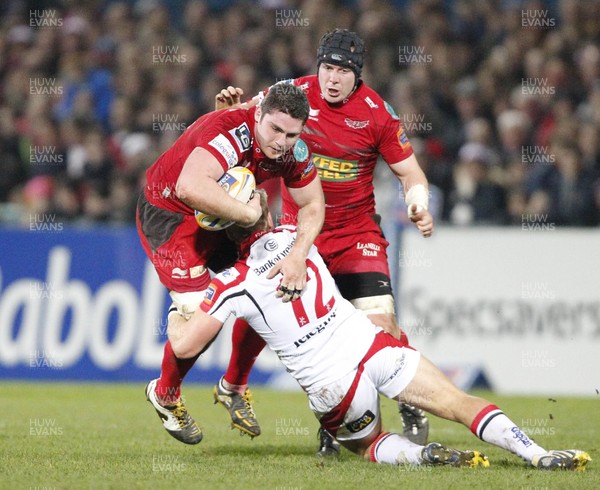 040113 Ulster v Scarlets - RaboDirect Pro 12 - Rob McCusker of Scarlets is tackled by Luke Marshall of Ulster 