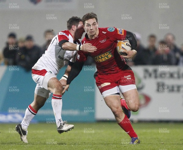 040113 Ulster v Scarlets - RaboDirect Pro 12 - George North of Scarlets is tackled by Paddy Wallace of Ulster 