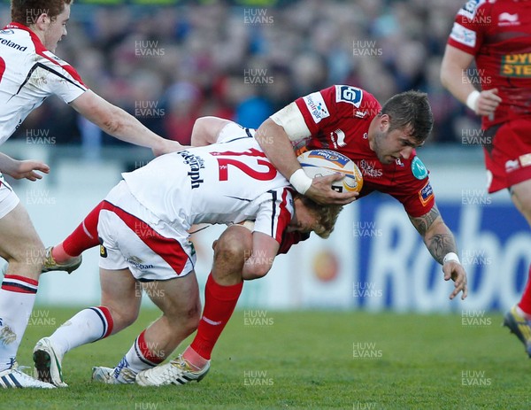 100513 - Ulster v Scarlets - RaboDirect Pro 12 Semi-Final - Rob McCusker of Scarlets is tackled by Stuart Olding of Ulster 