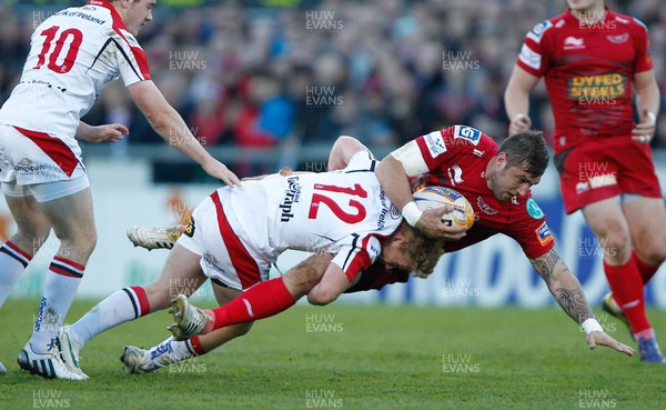 100513 - Ulster v Scarlets - RaboDirect Pro 12 Semi-Final - Rob McCusker of Scarlets is tackled by Stuart Olding of Ulster 