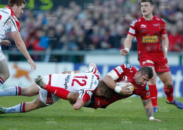 100513 - Ulster v Scarlets - RaboDirect Pro 12 Semi-Final - Rob McCusker of Scarlets is tackled by Stuart Olding of Ulster 