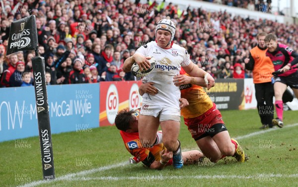 210216 - Ulster v Scarlets - Guinness PRO12 - Ulster's Luke Marshall goes over for a try before being bundled into touch by the Scarlet's DTH van der Merwe and Michael Collins