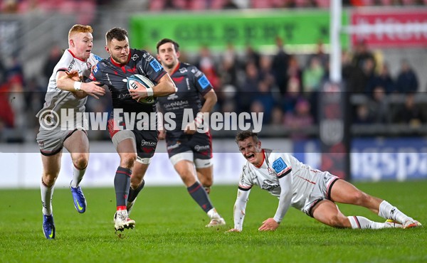 280122 - Ulster v Scarlets - United Rugby Championship - Steff Hughes of Scarlets is tackled by Nathan Doak of Ulster