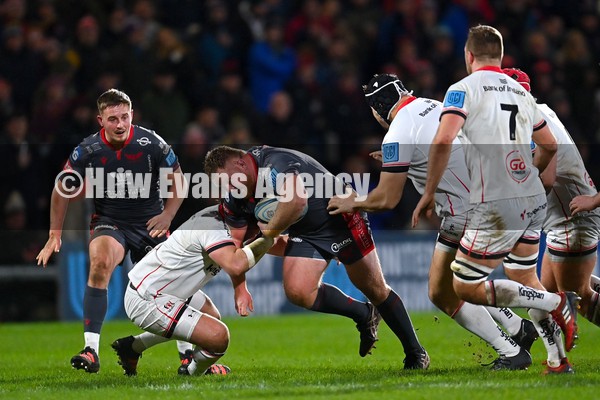 280122 - Ulster v Scarlets - United Rugby Championship - Samson Lee of Scarlets is tackled by John Andrew of Ulster