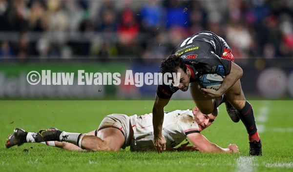 280122 - Ulster v Scarlets - United Rugby Championship - Ryan Conbeer of Scarlets is tackled by Ben Moxham of Ulster