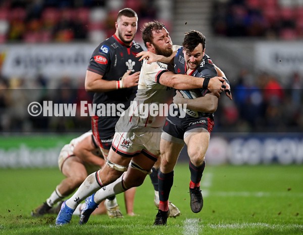 280122 - Ulster v Scarlets - United Rugby Championship - Ryan Conbeer of Scarlets is tackled by Duane Vermeulen of Ulster
