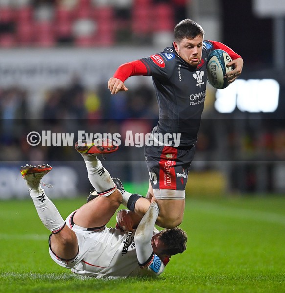 280122 - Ulster v Scarlets - United Rugby Championship - Steff Evans of Scarlets is tackled by Billy Burns of Ulster