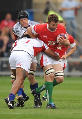 06.06.09 - USA Eagles v Wales - Wales' Deiniol Jones is tackled by USA's Matekitonga Moeakiola. 