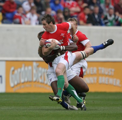 06.06.09 USA v Wales... Wales'  Andrew Bishop is tackled by USA's Ata Maiifa. 