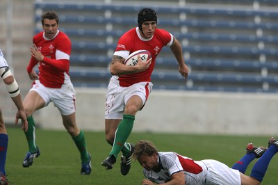06.06.09 USA v Wales... Wales'  Tom James gets past USA's Mike Hercus. 