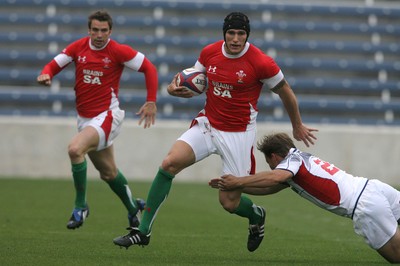 06.06.09 USA v Wales... Wales'  Tom James gets past USA's Mike Hercus. 