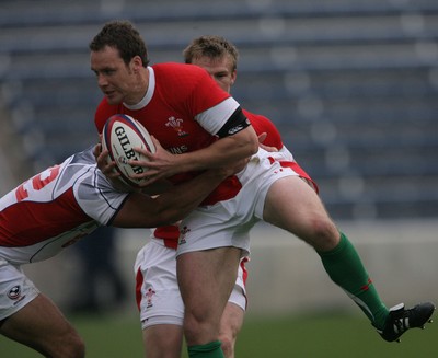 06.06.09 USA v Wales... Wales'  Mark Jones takes on USA's Junior Sifa.. 