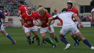 06.06.09 USA v Wales... Wales'  Duncan Jones takes on USA's Will Johnson.. 