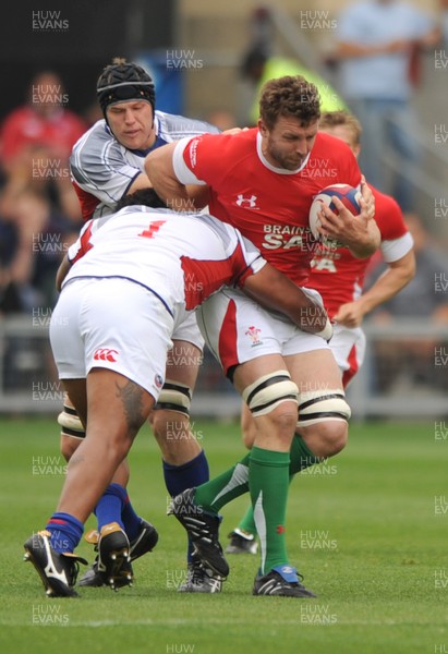 06.06.09 - USA Eagles v Wales - Wales' Deiniol Jones is tackled by USA's Matekitonga Moeakiola. 