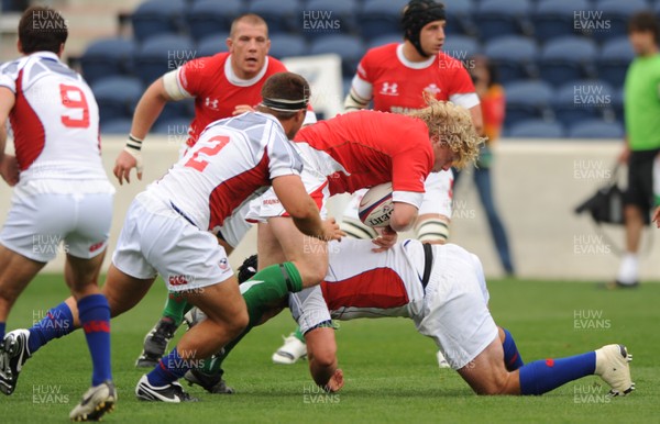06.06.09 - USA Eagles v Wales - Wales' Duncan Jones is tackled by USA's Chris Biller. 