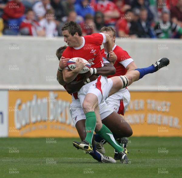 06.06.09 USA v Wales... Wales'  Andrew Bishop is tackled by USA's Ata Maiifa. 