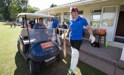 130714 - Usk Cricket Club v Newport Gwent Dragons, Charity T20 Cricket match, Usk - Newport Gwent Dragons player and former Wales and British Lions star Andy Powell makes his way to the wicket in a golf buggy as he opens the batting for the Dragons in a charity cricket match to raise money for charities Laurence Moon Bardot Beildle and St David’s Foundation Hospice Care 