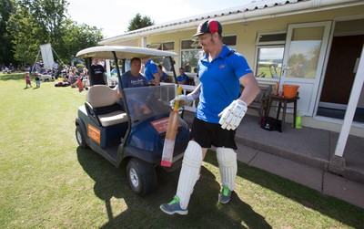 130714 - Usk Cricket Club v Newport Gwent Dragons, Charity T20 Cricket match, Usk - Newport Gwent Dragons player and former Wales and British Lions star Andy Powell makes his way to the wicket in a golf buggy as he opens the batting for the Dragons in a charity cricket match to raise money for charities Laurence Moon Bardot Beildle and St David’s Foundation Hospice Care 