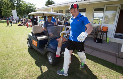 130714 - Usk Cricket Club v Newport Gwent Dragons, Charity T20 Cricket match, Usk - Newport Gwent Dragons player and former Wales and British Lions star Andy Powell makes his way to the wicket in a golf buggy as he opens the batting for the Dragons in a charity cricket match to raise money for charities Laurence Moon Bardot Beildle and St David’s Foundation Hospice Care 