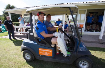 130714 - Usk Cricket Club v Newport Gwent Dragons, Charity T20 Cricket match, Usk - Newport Gwent Dragons player and former Wales and British Lions star Andy Powell makes his way to the wicket in a golf buggy as he opens the batting for the Dragons in a charity cricket match to raise money for charities Laurence Moon Bardot Beildle and St David’s Foundation Hospice Care 