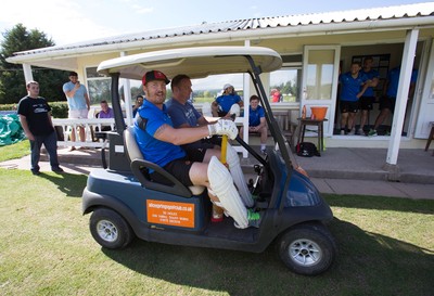 130714 - Usk Cricket Club v Newport Gwent Dragons, Charity T20 Cricket match, Usk - Newport Gwent Dragons player and former Wales and British Lions star Andy Powell makes his way to the wicket in a golf buggy as he opens the batting for the Dragons in a charity cricket match to raise money for charities Laurence Moon Bardot Beildle and St David’s Foundation Hospice Care 