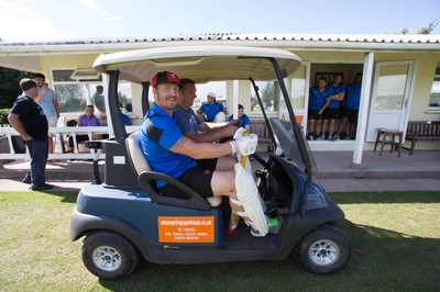 130714 - Usk Cricket Club v Newport Gwent Dragons, Charity T20 Cricket match, Usk - Newport Gwent Dragons player and former Wales and British Lions star Andy Powell makes his way to the wicket in a golf buggy as he opens the batting for the Dragons in a charity cricket match to raise money for charities Laurence Moon Bardot Beildle and St David’s Foundation Hospice Care 